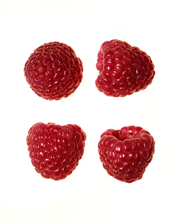 Close-up of raspberries on white Photograph by Brian Hagiwara
