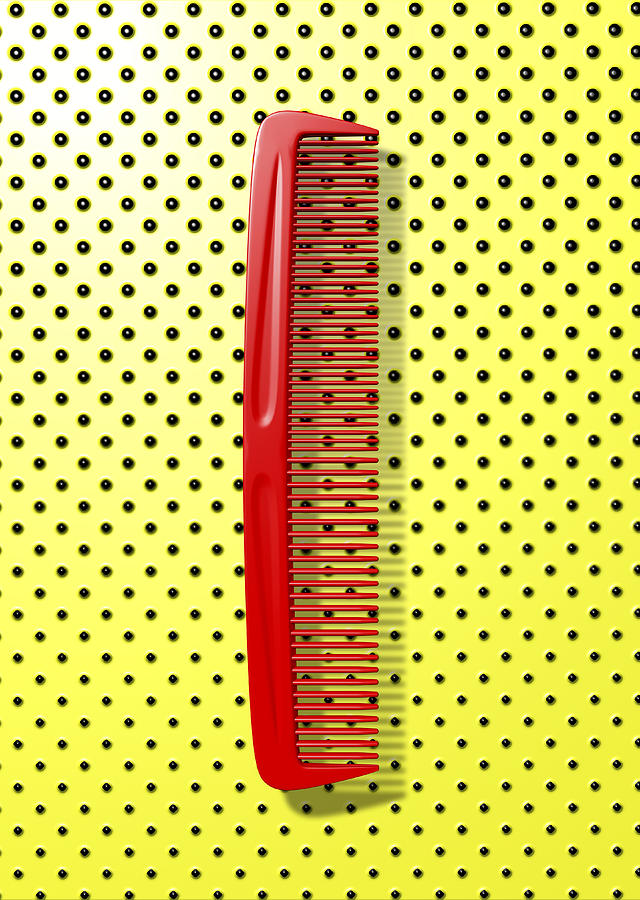 Close up of red comb on polka dot background Photograph by Chris Clor