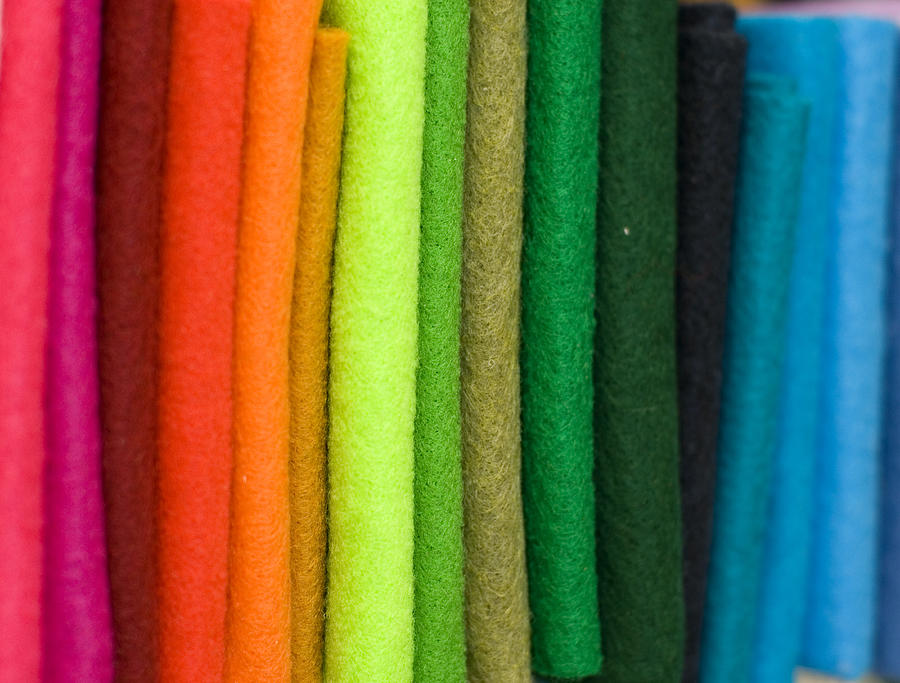 Close up of row of coloured felt material for sale Photograph by Lyn Holly Coorg