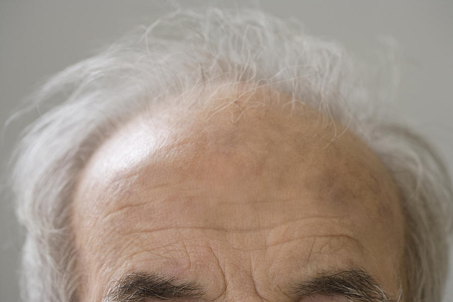 Close up of senior Hispanic manÂ¿s balding head Photograph by Jose Luis Pelaez Inc