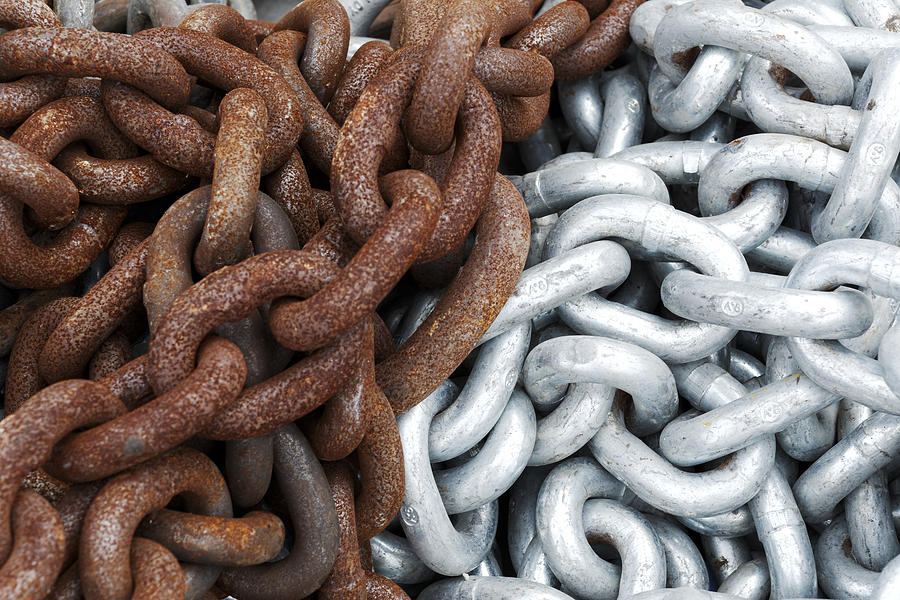 Close up of shiny and rusted metal chains Photograph by PhotoStock-Israel