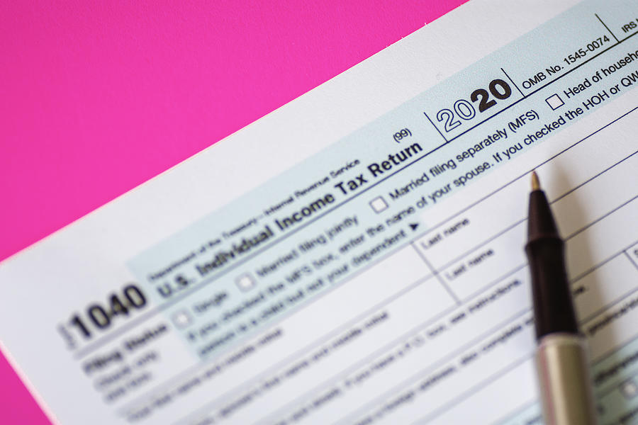 Close Up of Tax Form 1040 For Year 2020 on Pink Background Photograph by Constantine Johnny