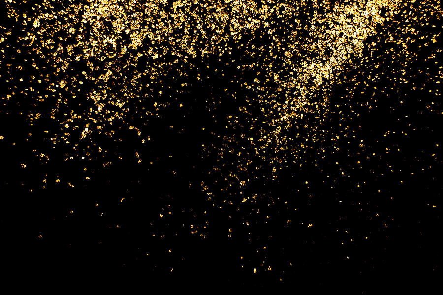 Close Up Of The Golden  Glitter On Black Background Photograph by Severija Kirilovaite
