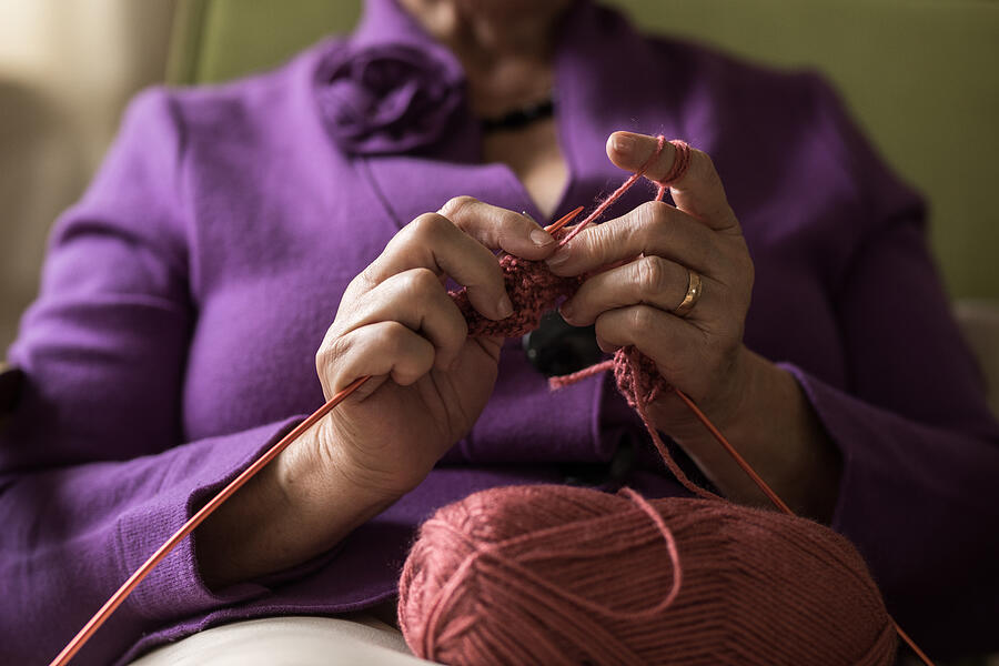 Close up of unrecognizable senior woman knitting. Photograph by StockPlanets