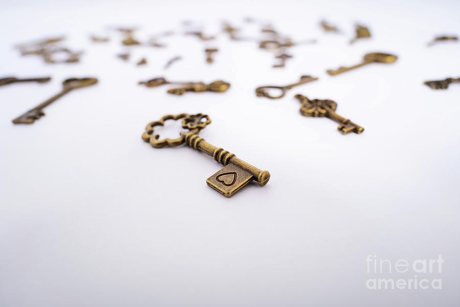 Close up of vintage key with a heart engraving Photograph by Mendelex Photography