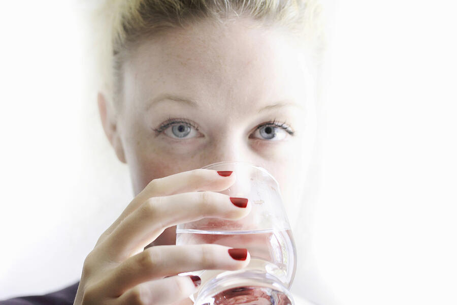 Close up of woman drinking glass of wine Photograph by Sigrid Gombert