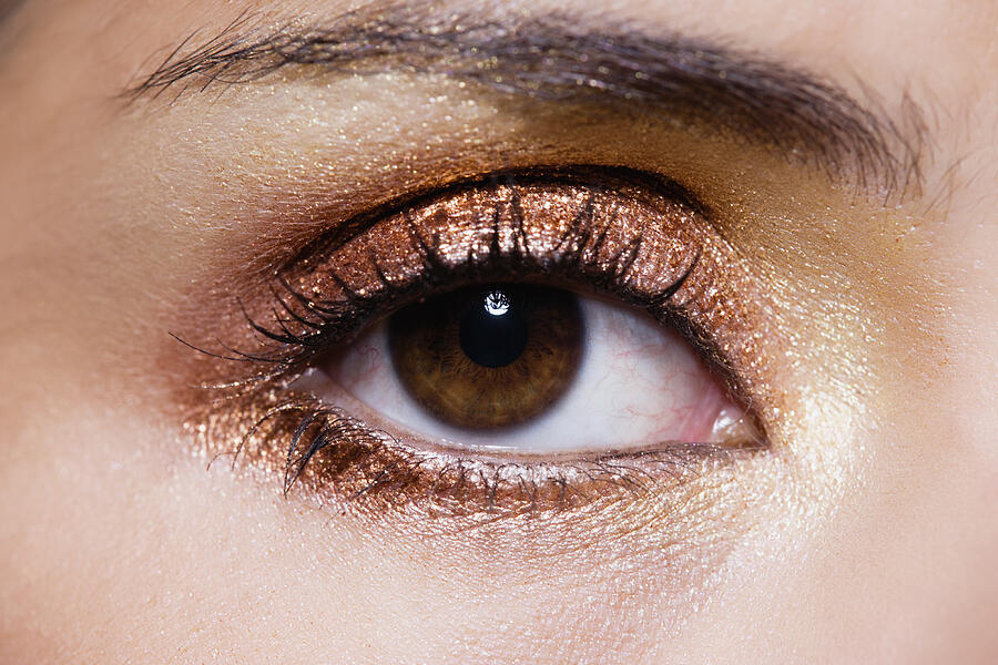 Close up of womans eye with gold eye make-up Photograph by ColorBlind