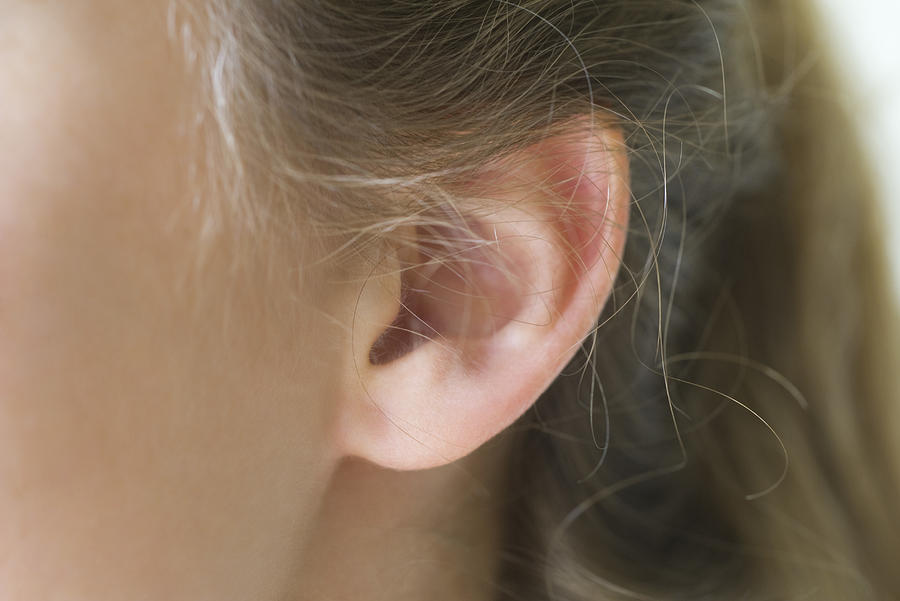 Close-up of young womans pierced ear Photograph by ZenShui/Frederic Cirou