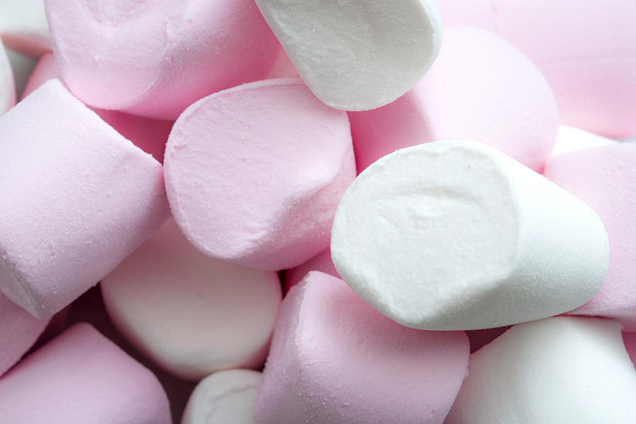 Close up on a heap of marshmallow sweets with copyspace Photograph by Moussa81