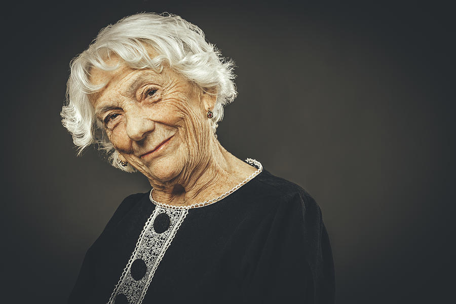 Close-up portrait of a beautiful senior lady Photograph by Eva-Katalin