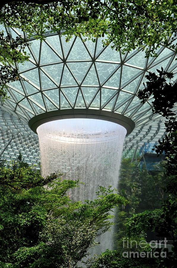 Close up view of waterfall surrounded by trees foliage at Jewel Changi airport Singapore Photograph by Imran Ahmed