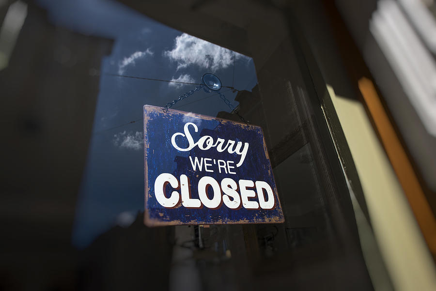 Closed sign on the front door of a shop Photograph by Thomas Winz