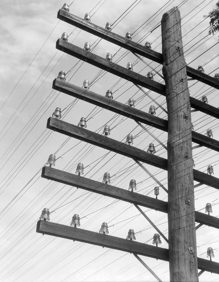 Closeup Of Telephone Pole With 6 Levels Of Wires. Photograph by H. Armstrong Roberts