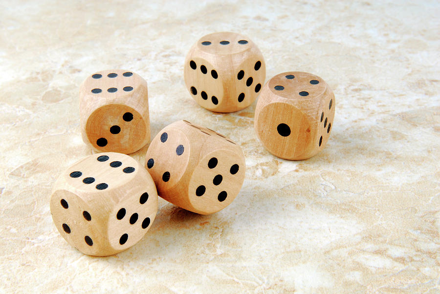 Closeup Of The Dices On Marble Stone Table Photograph by Severija Kirilovaite