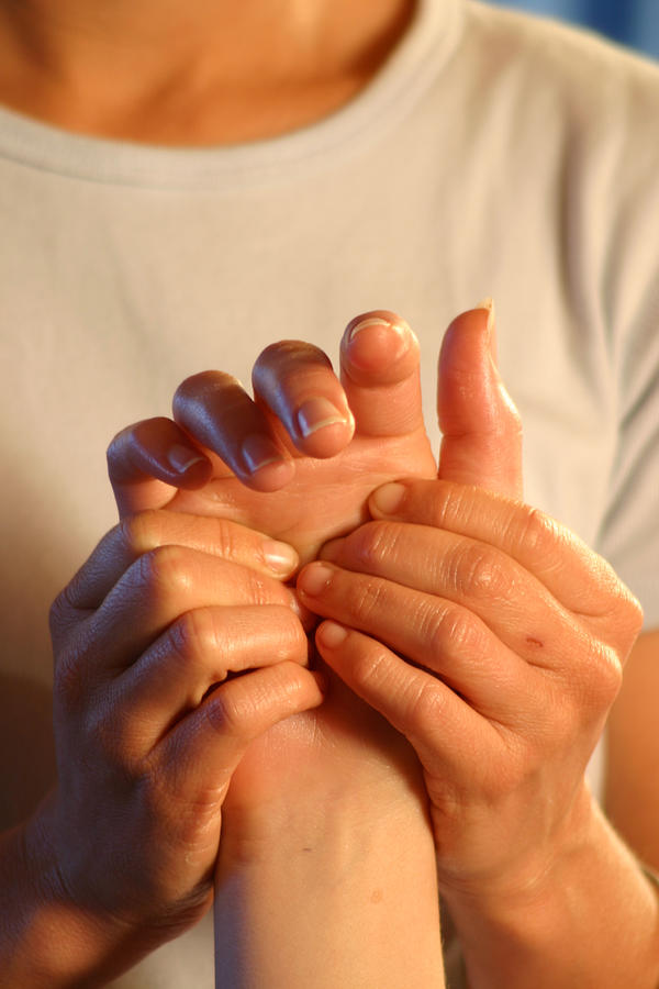 Closeup of woman masseuse massaging mans hand Photograph by Matt_scherf
