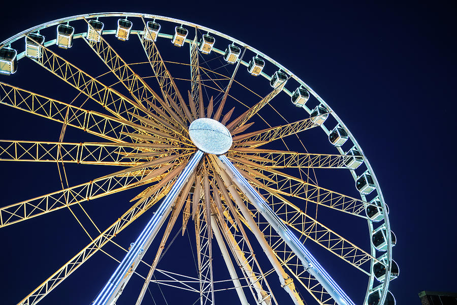 Closeup view of illuminated ferries wheel against night sky located over motlawa river Photograph by Arpan Bhatia