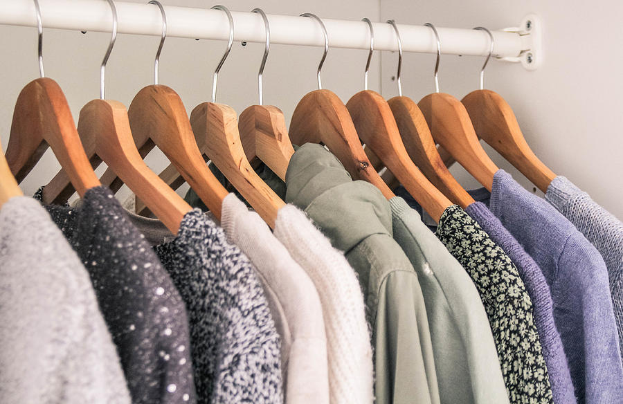 Clothes hanging in the wardrobe Photograph by Kinga Krzeminska
