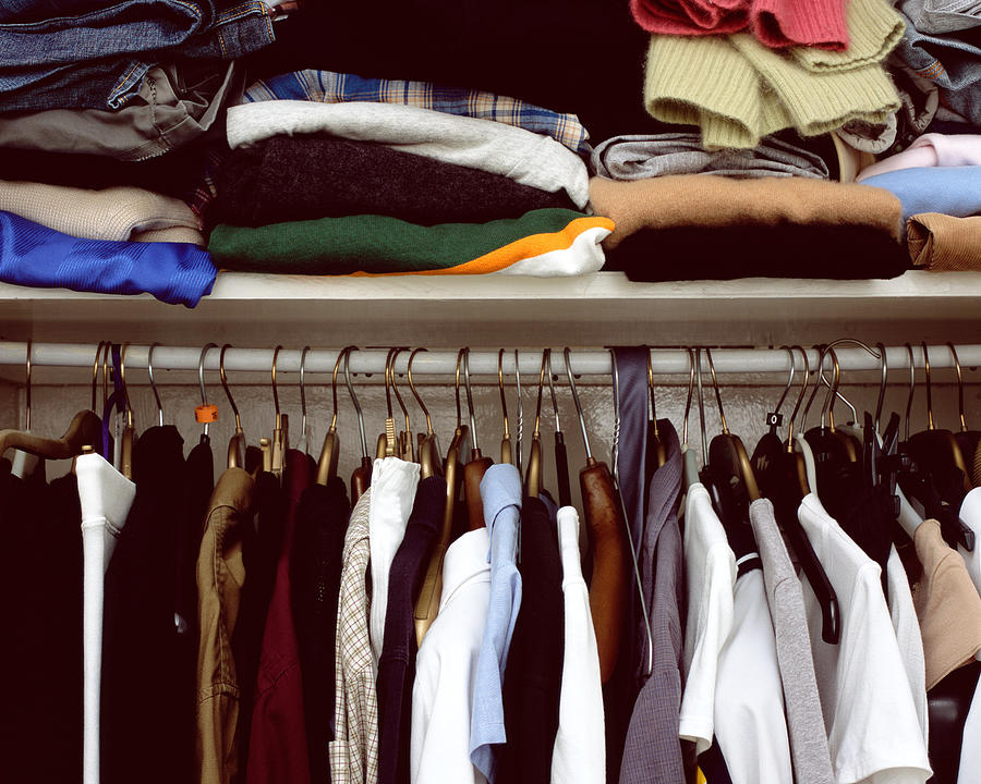 Clothes in cupboard Photograph by Image Source