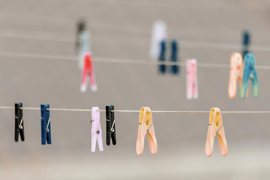 Clothes pegs on the washing line Photograph by Artush Foto - Fine Art ...