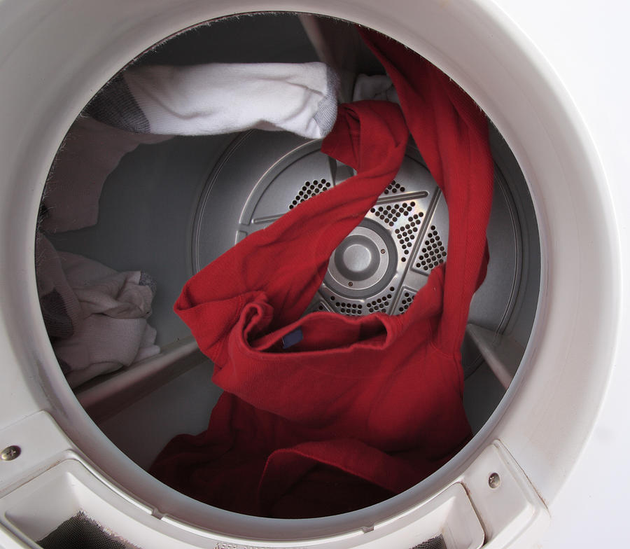 Clothes Tumbling in Dryer Photograph by Saturated