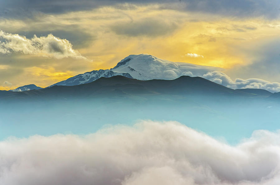 Cloud bank and sunrise on the Cayambe volcano Photograph by Henri Leduc