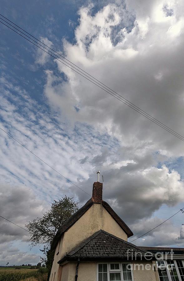 Clouds and Cottage Photograph by Andy Thompson