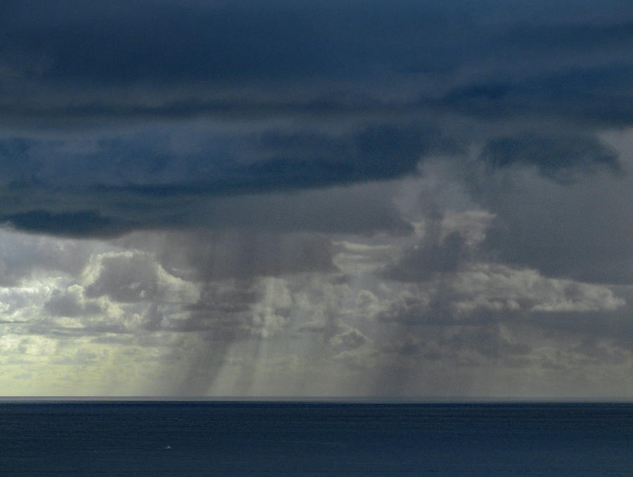 Clouds and Rain over the Ocean Photograph by Corinne Carroll
