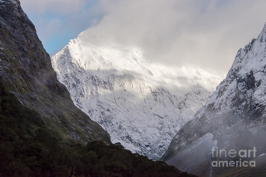 Clouds and Snow around Milford Sound One Photograph by Bob Phillips