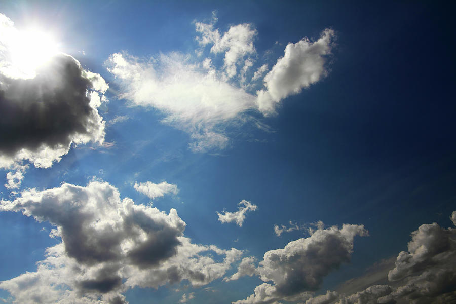 Clouds And Sun On Blue Sky Photograph by Mikhail Kokhanchikov