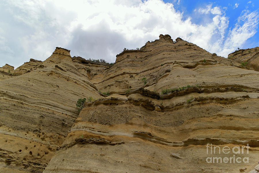 Clouds and tent rocks Photograph by Jeff Swan