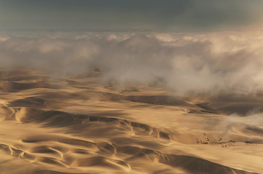 Clouds over desert in the Skeleton Coast Photograph by Buena Vista Images