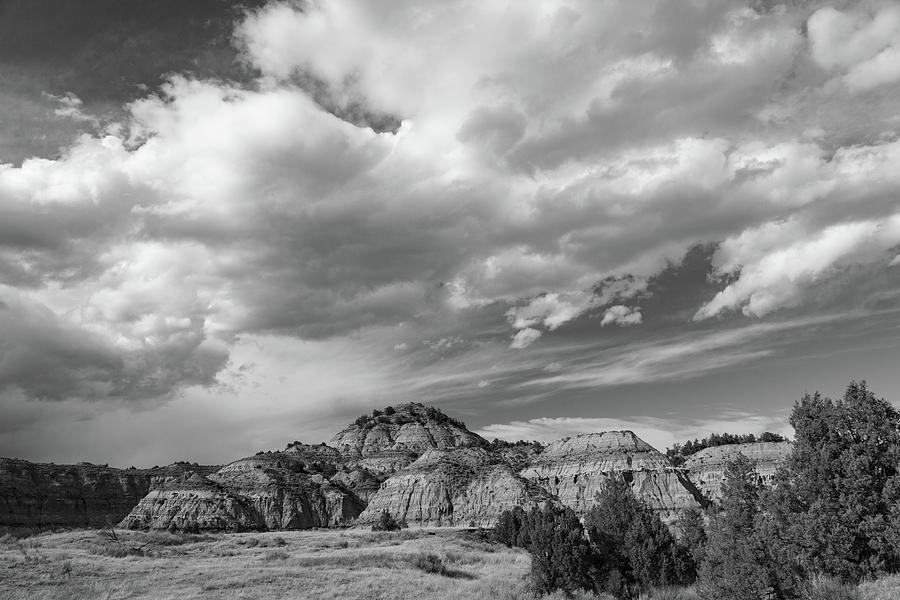 Clouds over mountain at Theodore Roosevelt National Park in North Dakota in black and white Photograph by Eldon McGraw