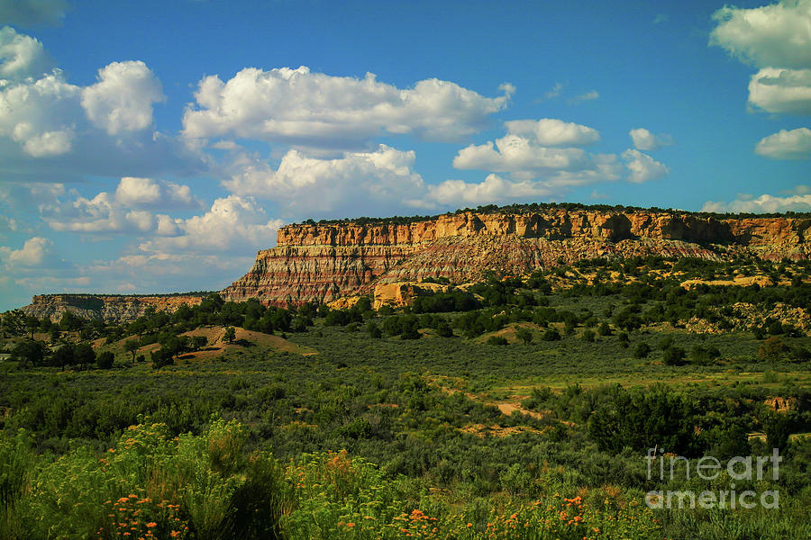 Clouds over rugged New Mexico  Photograph by Jeff Swan