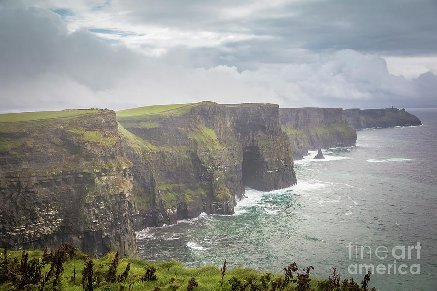 Clouds over the cliffs of Moher Photograph by Agnes Caruso