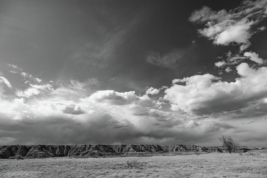 Clouds over Theodore Roosevelt National Park in North Dakota in black and white Photograph by Eldon McGraw