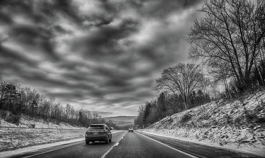 Clouds, trees and the highway Photograph by Alan Goldberg