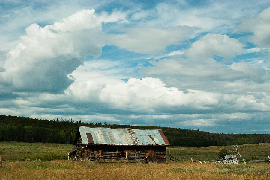 Cloudscape over log Cabin North Park Wyoming Photograph by Robert Ford ...