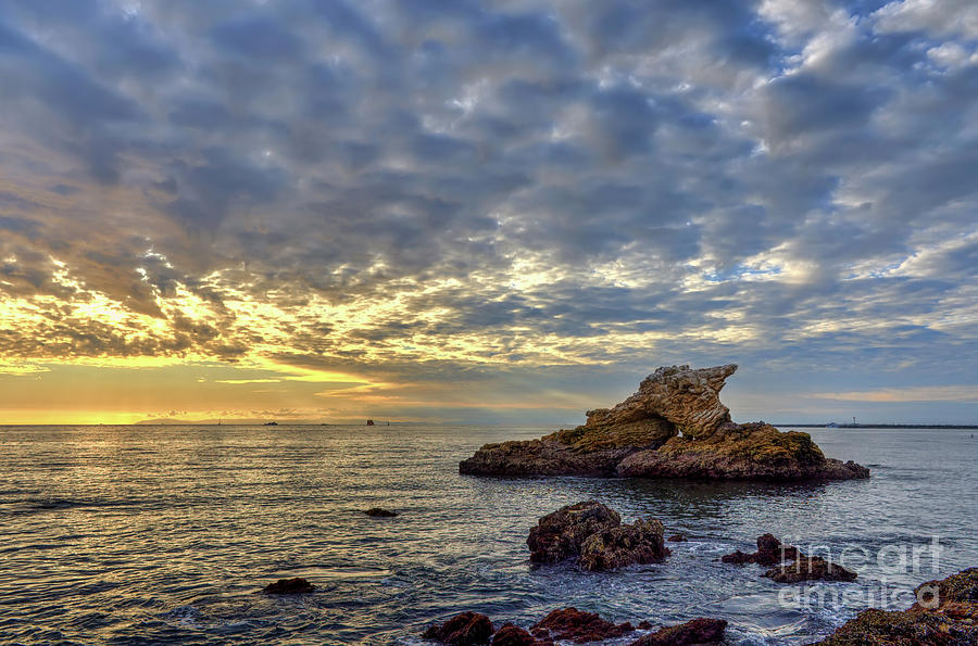 Cloudy Skies At Arch Rock Photograph by Eddie Yerkish