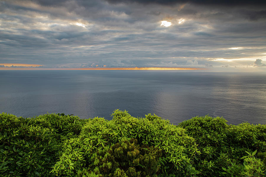 Cloudy sunset over Flores west coast Photograph by Ruben Vicente