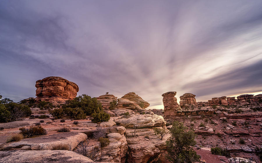 cloudy sunset with sun rays in Canyonlands National Park Photograph