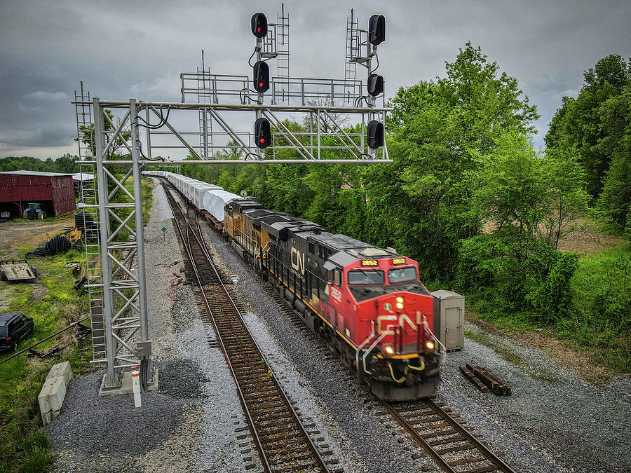 CN 2852 leads Northbound W986 at Robards Ky with Windmill Train Photograph by Jim Pearson