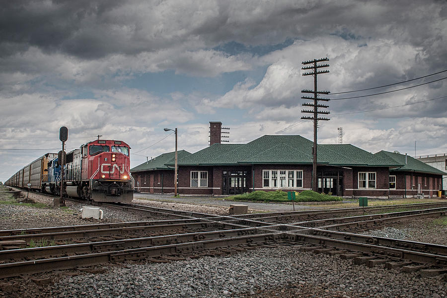 CN 5699 leads a southbound autorack south past the depot at Effingham Illinois Photograph by Jim Pearson