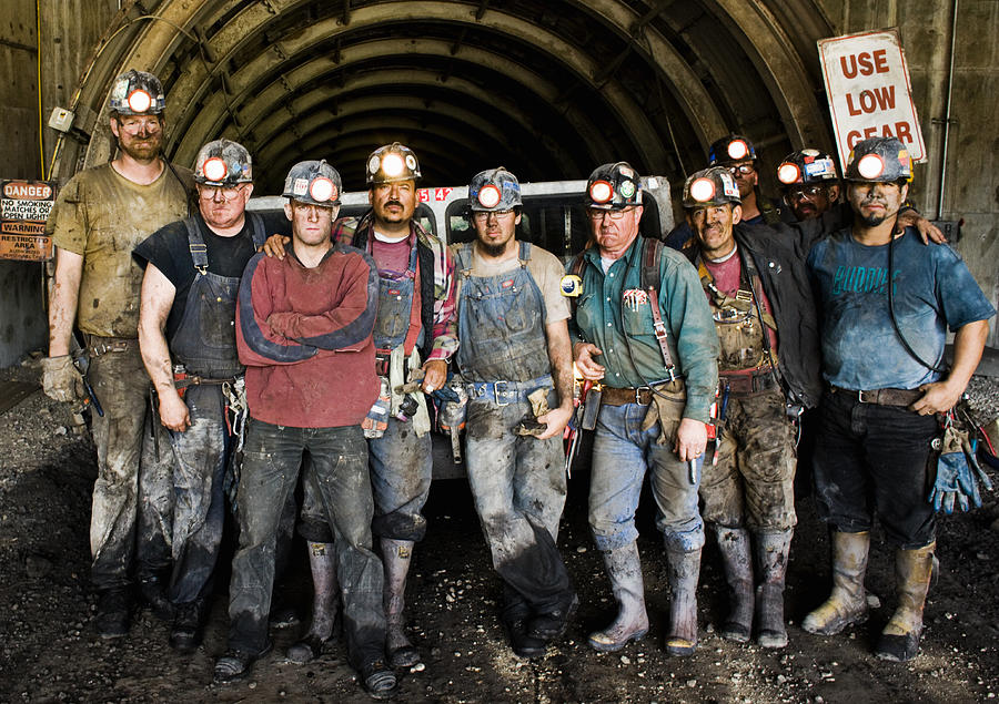 Coal miners in front of mine shaft, portrait Photograph by Tyler Stableford