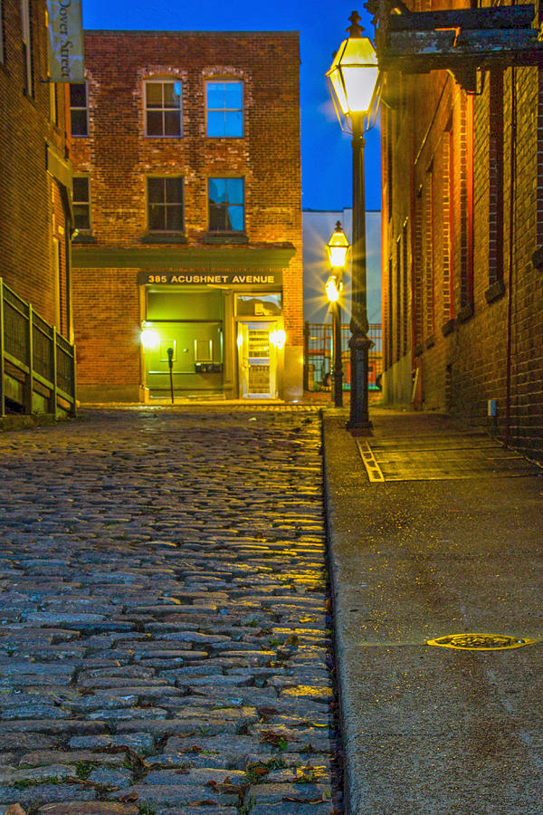 Cobblestone street at night Photograph by Nautical Chartworks