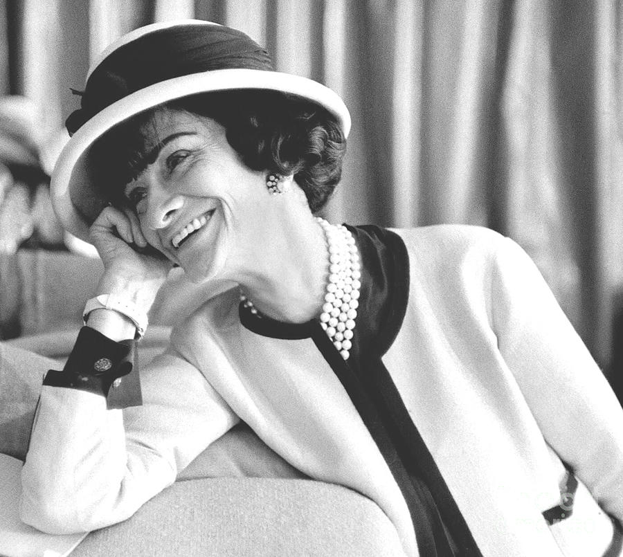 Perfume Photograph - Coco Chanel wearing her Signature Suit- by Diane Hocker