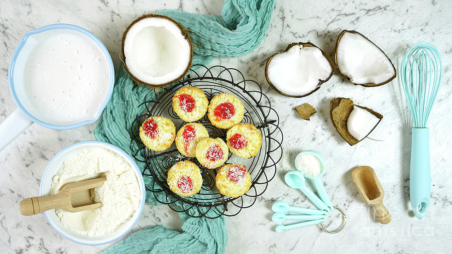 Coconut baking theme flat lay creative layout overhead with baked macaroons. Photograph by Milleflore Images