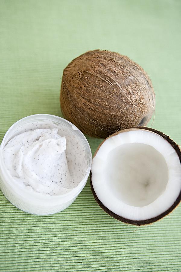 Coconuts and cosmetic cream Photograph by Image Source