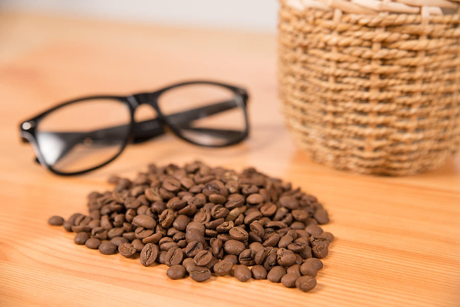 Coffee beans and glasses Photograph by PhotoAttractive