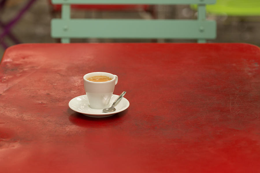 Coffee cup on a old iron red table Photograph by Jean-Marc PAYET