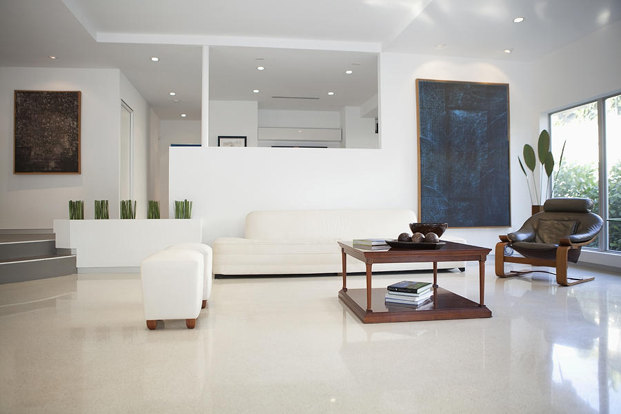 Coffee table, chairs and walls in modern living space Photograph by Camilo Morales